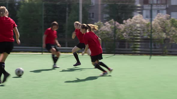 Girls Playing Soccer and Scoring Goal