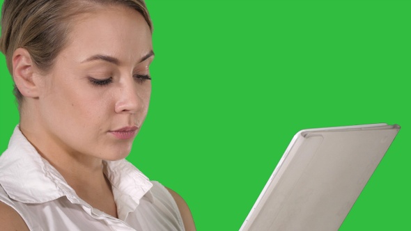 Young Attractive Business Woman Holding a Tablet Computer