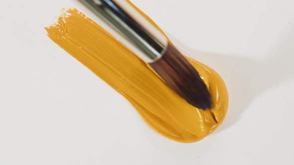 Mixing Yellow Paint Closeup