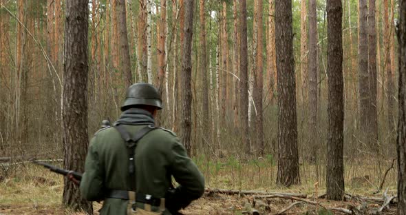 World War II German Wehrmacht Infantry Soldiers Of World War II Marching Along Forest In Spring