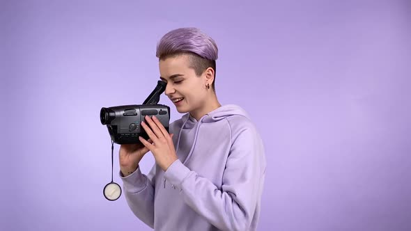 Generation Z Person Using Old VHS Camcorder Shooting Video Isolated