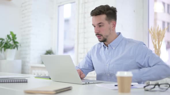 Creative Man Standing Up and Leaving Office After Work