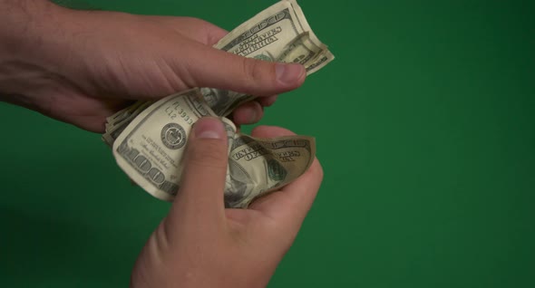 Dollars. American Money Close-up on a Green Background Hromakey . 100 Dollar Bills. One Hundred