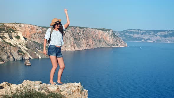 Happy Active Travel Woman Dancing Having Fun on Top of Mountain Enjoying Positive Emotion