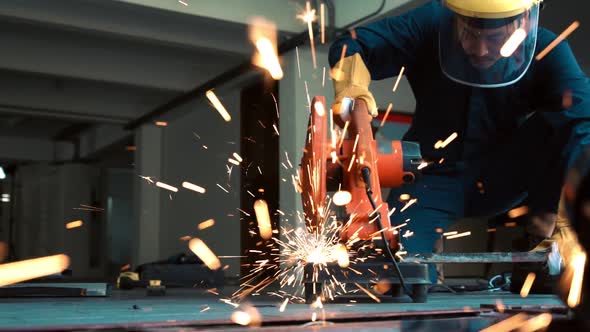 Professional Mechanic is Cutting Steel Metal