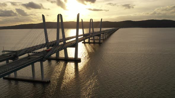 An aerial shot of the Mario M. Cuomo Bridge taken on the north side. The drone camera dolly out over