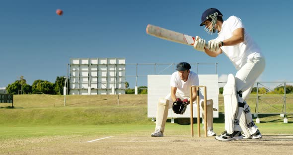 Batsman Hitting a Ball During Cricket Match