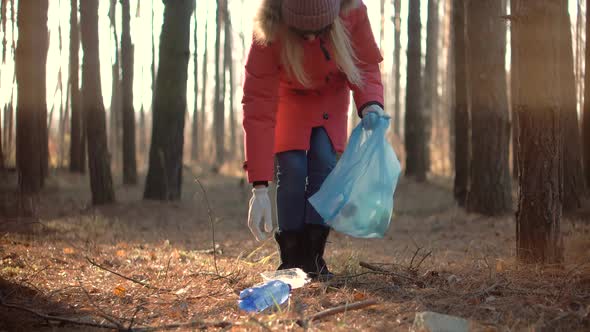 Cleaner Woman Collecting Trash In Forest. Trash Volunteer Eco Activist. Save Planet.