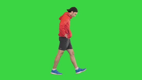 Sportsman Walking and Having a Heart Pain on a Green Screen Chroma Key