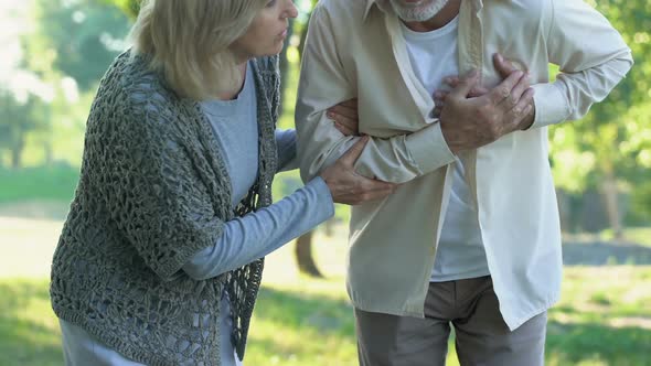 Aged Man Having Heart Pain During Walk With Wife, Heart Attack, Healthcare
