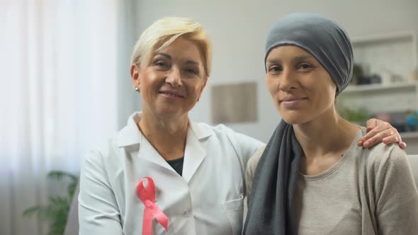 Oncologist and Cancer Patient Looking Into Camera, Hoping for Healing Survival