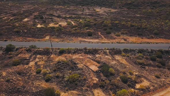Top View of a Car Rides Along a Desert Road on Tenerife Canary Islands Spain