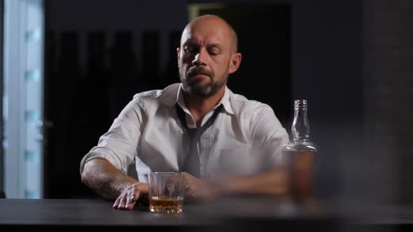 Depressed Adult Businessman Drinking Whiskey