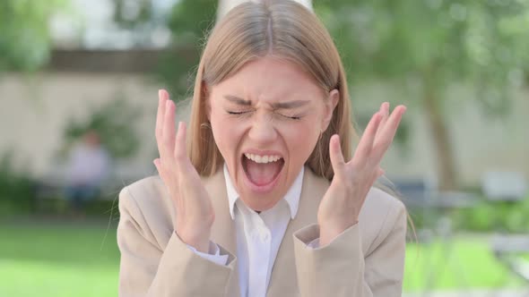 Outdoor Portrait of Angry Young Businesswoman Screaming Shouting