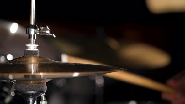 Hands of Musician Drummer Holding Drum Sticks Hitting on Hihat Cymbal