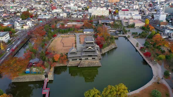 Aerial View 4k footage of Matsumoto Castle on morning in Matsumoto city.