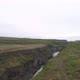 Aerial flight over a glacial mountain river in Iceland - VideoHive Item for Sale