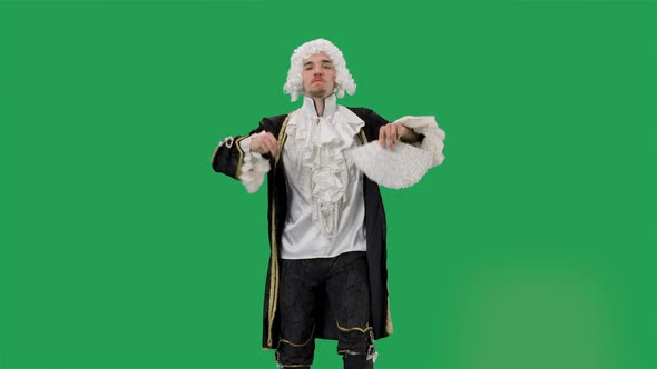 Portrait of Courtier Gentleman in Black Historical Vintage Suit and White Wig Dancing Merrily with a