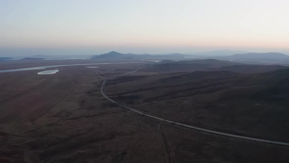 Aerial Footage of a Flock of Whitenecked Cranes at Sunset