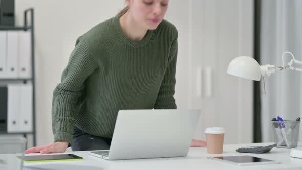 Young Woman Standing Up, Going Away Laptop 