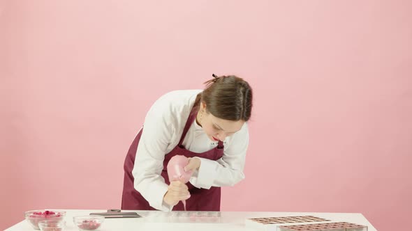 Chocolate Production, Candymaking - Chocolatier Filling Mold with Ruby Chocolate