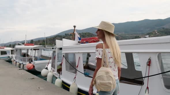 Beautiful Girl Tourist Walking in the Poros City Greece