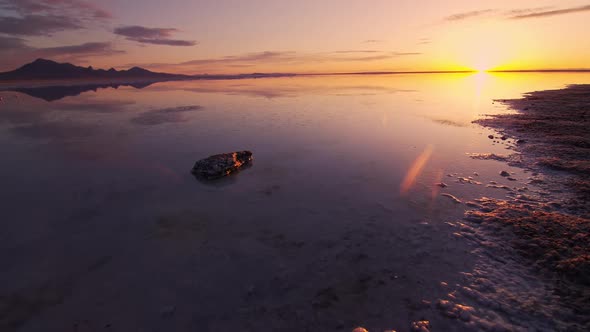 Panning over the Bonneville Salt Flats during colorful sunrise