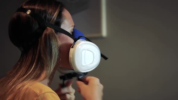 Woman wearing Respiratory Mask to Protect from Coronavirus.