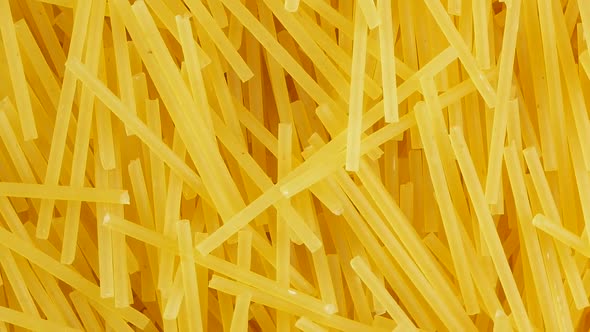 Spaghetti - yellow pasta, ready for cooking.