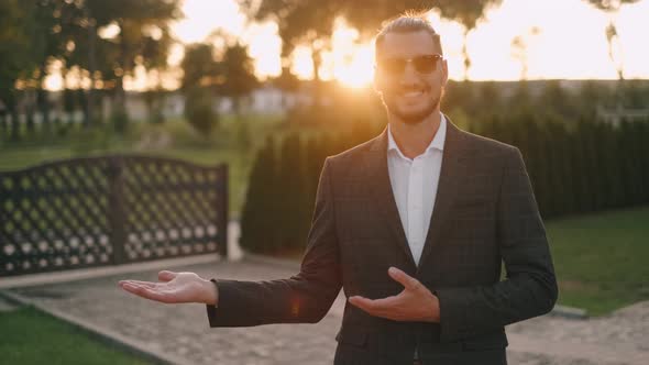 Successful Businessman Is Keeping Space for Copying on His Palm. Man Presenting Something with Open