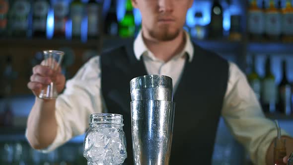 The Bartender Is Preparing an Alcoholic Cocktail