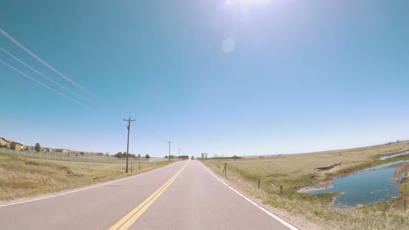 POV point of view - Driving through countryside in Eastern Colorado.