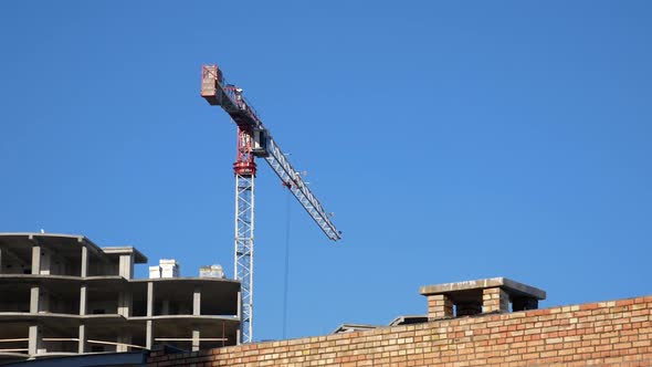 Сonstruction crane. the house is being built brick