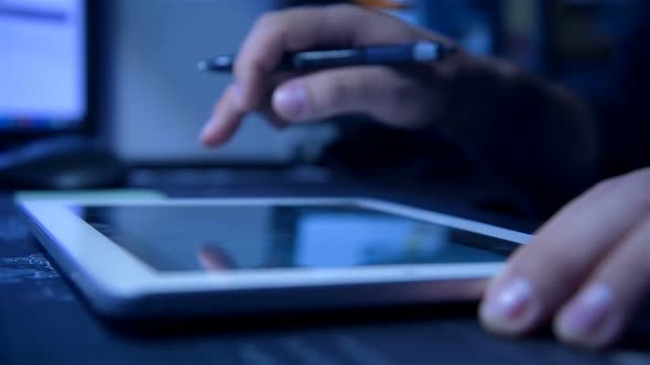 Businessman Using Digital Tablet With Stock Spreadsheet