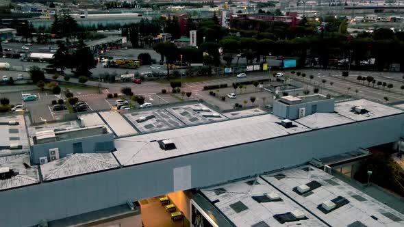 CALENZANO ITALY NOVEMBER 3 2021 Aerial View of Shopping Mall Area and Surrounding Cityscape at