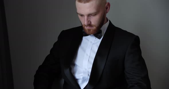 the Groom Reads a Speech From a White Postcard