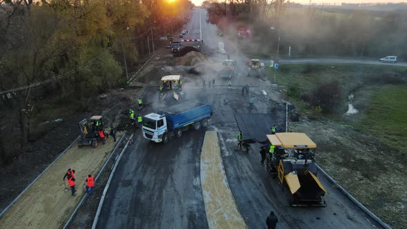 Rivne, Ukraine November 6, 2021. Construction Of The Highway, Laying Of Asphalt