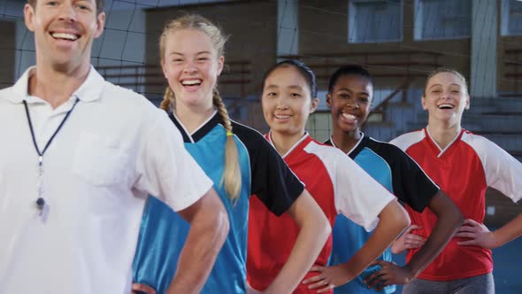 Male coach and volleyball players standing in a row 4k