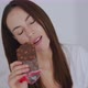 Flirty Woman Enjoying Bar of Sweet Chocolate - VideoHive Item for Sale