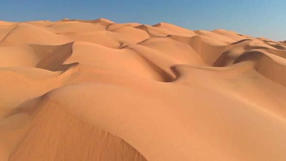 Flying Over Endless Sand Dunes in Arabian Desert. Arabian Peninsula, Oman