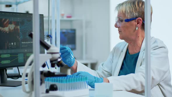 Medical Lab Worker Analyzing Blood Serum Conducting Virus Test