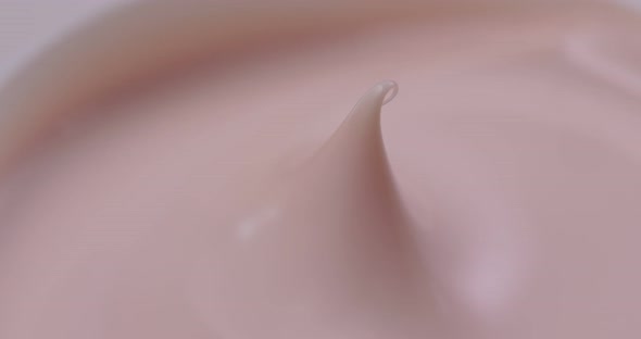 Pink cosmetics cream in rotation