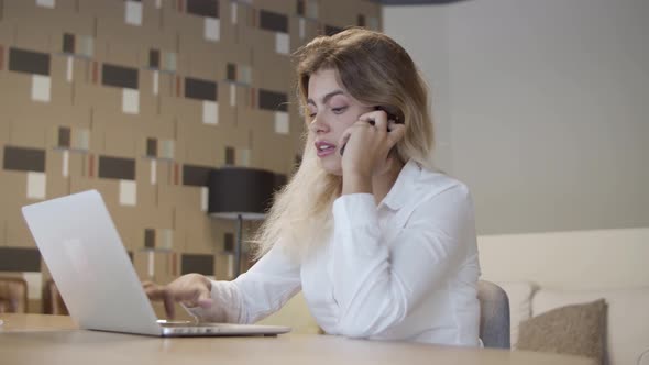 Positive Friendly Businesswoman Talking on Phone