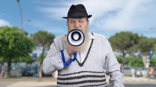 Senior Man Making an Announcement Through Megaphone