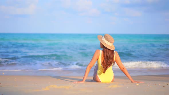 Asian woman enjoy around beautiful beach sea ocean