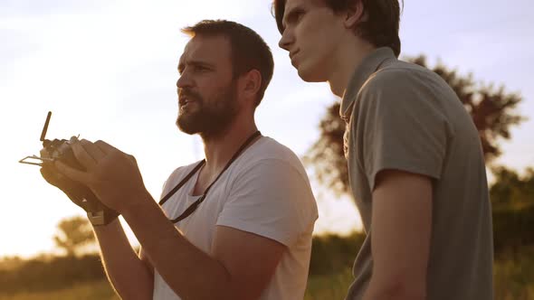 Two People Operating Drone