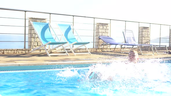 Mother and Daughter Playing in a Swimming Pool