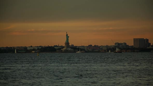 USA, New York, New York City, Statue of Liberty at sunset