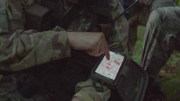Detachment Commander Using Army Grade Gadget Giving Orders to Squad