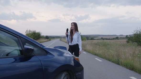 Slow Motion of a Girl That Dances with Car Charger